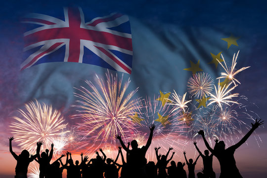 People are looking on fireworks and flag of Tuvalu
