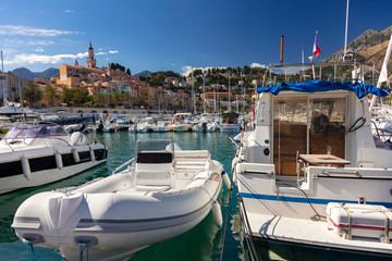 Boats in Menton harbor and the Basilique Saint-Michel, France, Europe