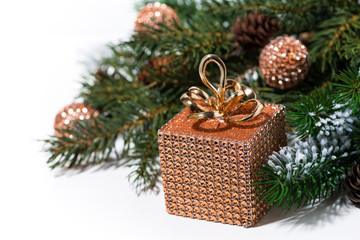 Fototapeta na wymiar Christmas decoration golden box and fir branches on white background