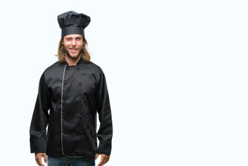 Young handsome cook man with long hair over isolated background winking looking at the camera with...