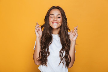 Portrait of a happy young girl with long brunette hair - obrazy, fototapety, plakaty