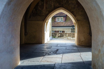 Fototapeta premium Near the entrance of the City Church Thun (Switzerland) which is located near the Castle of Thun. The church, which dominates the Old Town of Thun, is defined by its medieval tower and baroque aisle