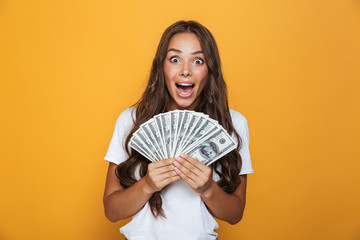 Portrait of an excited young girl with long brunette hair