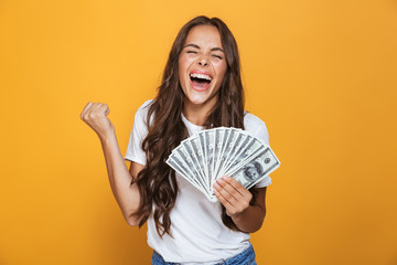 Portrait of a happy young girl with long brunette hair