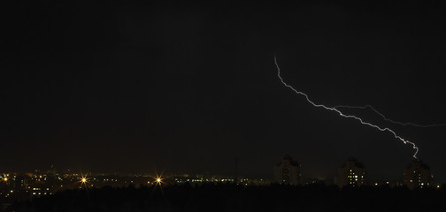 Lightning over the city at night
