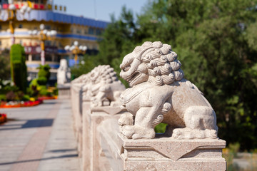 Fototapeta na wymiar Stone lions on Xi Daqiao Bridge Urumqi Xinjiang China