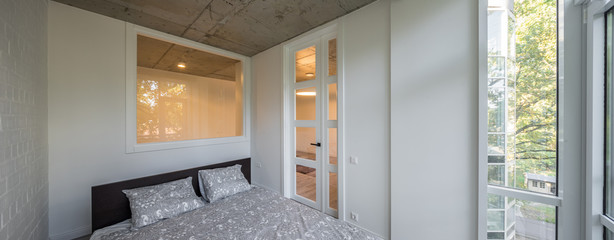 Bed in the apartment. Bedroom in studio apartment. © Aleks Kend