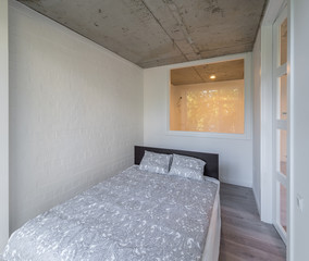 Bed in the apartment. Bedroom in studio apartment. © Aleks Kend