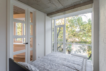 Bed in the apartment. Bedroom in studio apartment. © Aleks Kend