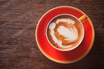 Coffee cup on old wooden background , top view