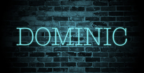 first name Dominic in blue neon on brick wall