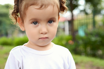 Portrait of baby girl in park.