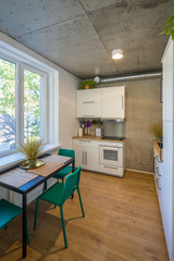 The kitchen and dining room in a modern apartment. Kitchen area in studio apartments. © Aleks Kend