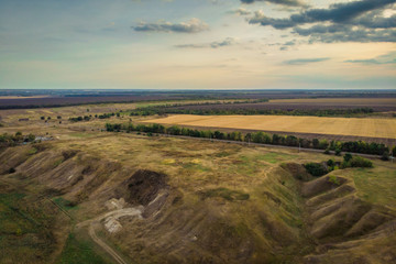Aerial view of nature panorama with hills and meadows in rural area, drone photo