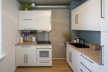 The kitchen and dining room in a modern apartment. Kitchen area in studio apartments. © Aleks Kend