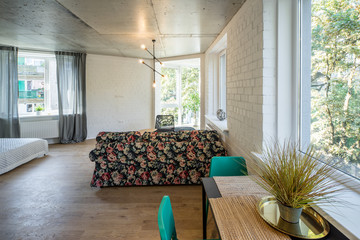 The kitchen and dining room in a modern apartment. Kitchen area in studio apartments. © Aleks Kend