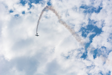 A Plane Executing a Beautiful Parabola near the Clouds