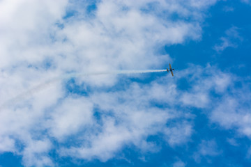 A Plane Flying Towards the Clouds at an Airshow