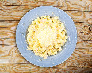Grated Cheese on Pasta Isolated on White Background