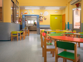 Interior diner and kitchen in kindergarten with tables and chairs for kids. Kindergarten concept. Colorful