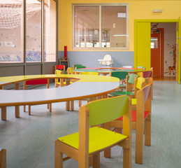 Interior view of diner with colorful tables and chairs in kindergarten. Kindergarten concept
