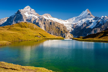 Encountering Bachalpsee during the famous hiking trail from First to Grindelwald (Bernese Alps, Switzerland). You can have great views on mountains like the Eiger, Monch and Jungfrau.