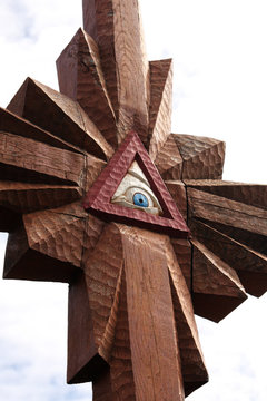 Wooden cross with the Eye of Providence on the Hill of Crosses in Lithuania