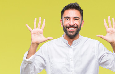Fototapeta premium Adult hispanic man over isolated background showing and pointing up with fingers number ten while smiling confident and happy.