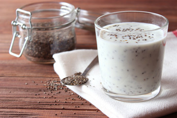 chia pudding with yogurt on a wooden background. A simple recipe for proper nutrition, useful supplements, super food