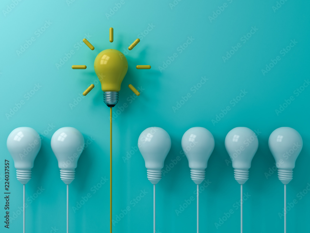 Poster think different concept one yellow idea light bulb standing out from the white unlit bulbs on blue g