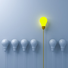 Think different concept One glowing light bulb standing out from the dim or unlit white lightbulbs on white wall background with shadows leadership and individuality creative idea concept 3D rendering