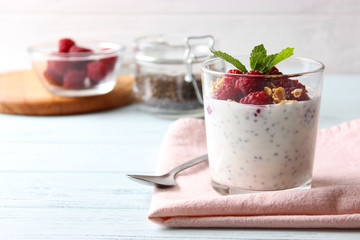 chia pudding with raspberries and granola on a light background. Proper nutrition, super food, healthy breakfast.