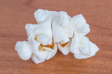 Fototapeta na wymiar Close-up of white pop corn on wooden table.