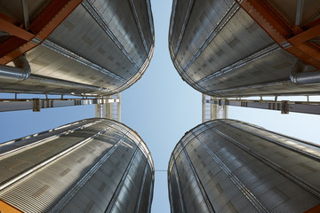 Modern silos for storing grain harvest. Agriculture. Background.