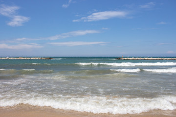 Mooring coast with waves on sunny day. Seascape background. Mooring bay concept. Travel and tourism concept. 