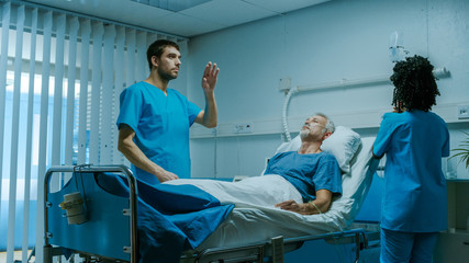Futuristic Medical Ward with Sick Patient Lying in Bed and Doctor using Gestures for Augmented Reality. Great Template for Future Technology.