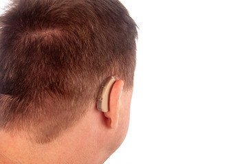 Man wearing hearing aid viewed from back. Isolated on white.