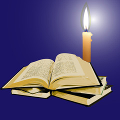 open old book with a candle in the night