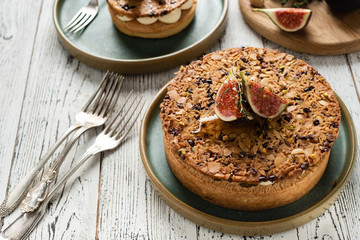 Tarte on sand base with fresh figs, almonds and crispy waffle with almonds and cocoa powder. Fresh Homemade Fruit Tart with berries