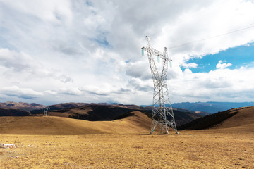 High voltage transmission tower or power tower (electricity pylon) and electrical distribution...