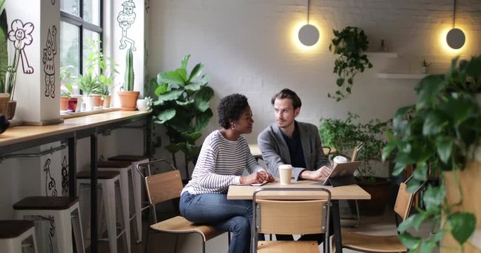 Coworkers having a meeting in a cafe