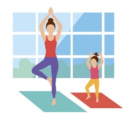 Mother teaches her daughter how to practice yoga in the hall