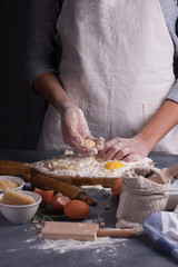 Baker prepares the dough on table for making pasta