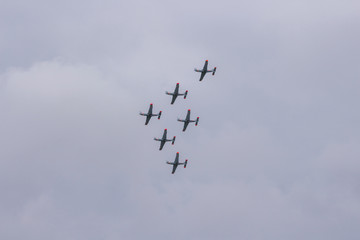 Aerobatic team performs flight, Planes flying in formation, Air show