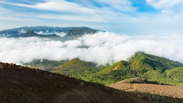 Timelapse sequence of tradewind clouds moving against the mountains of La Palma between the Caldera de Taburiente in the background and the Cumbre Vieja. Seen from the top of the volcano Birigoyo in t