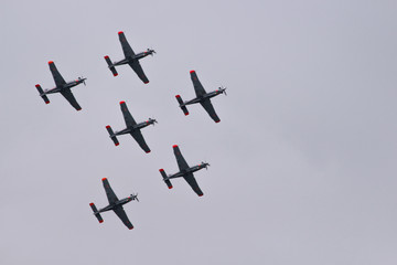 Fototapeta na wymiar Aerobatic team performs flight, Planes flying in formation, Air show