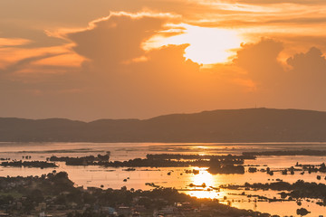 Mandalay city with Irrawaddy river and mountains background from top of Mandalay Hill at Sunset. landmark and popular for tourist attractions in Myanmar