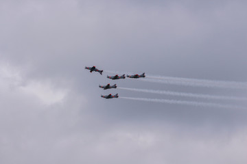 Aerobatic team performs flight, Planes flying in formation, Air show