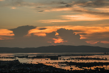 Mandalay city with Irrawaddy river and mountains background from top of Mandalay Hill at Sunset. landmark and popular for tourist attractions in Myanmar