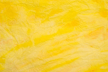 yellow creased colored tissue paper background texture